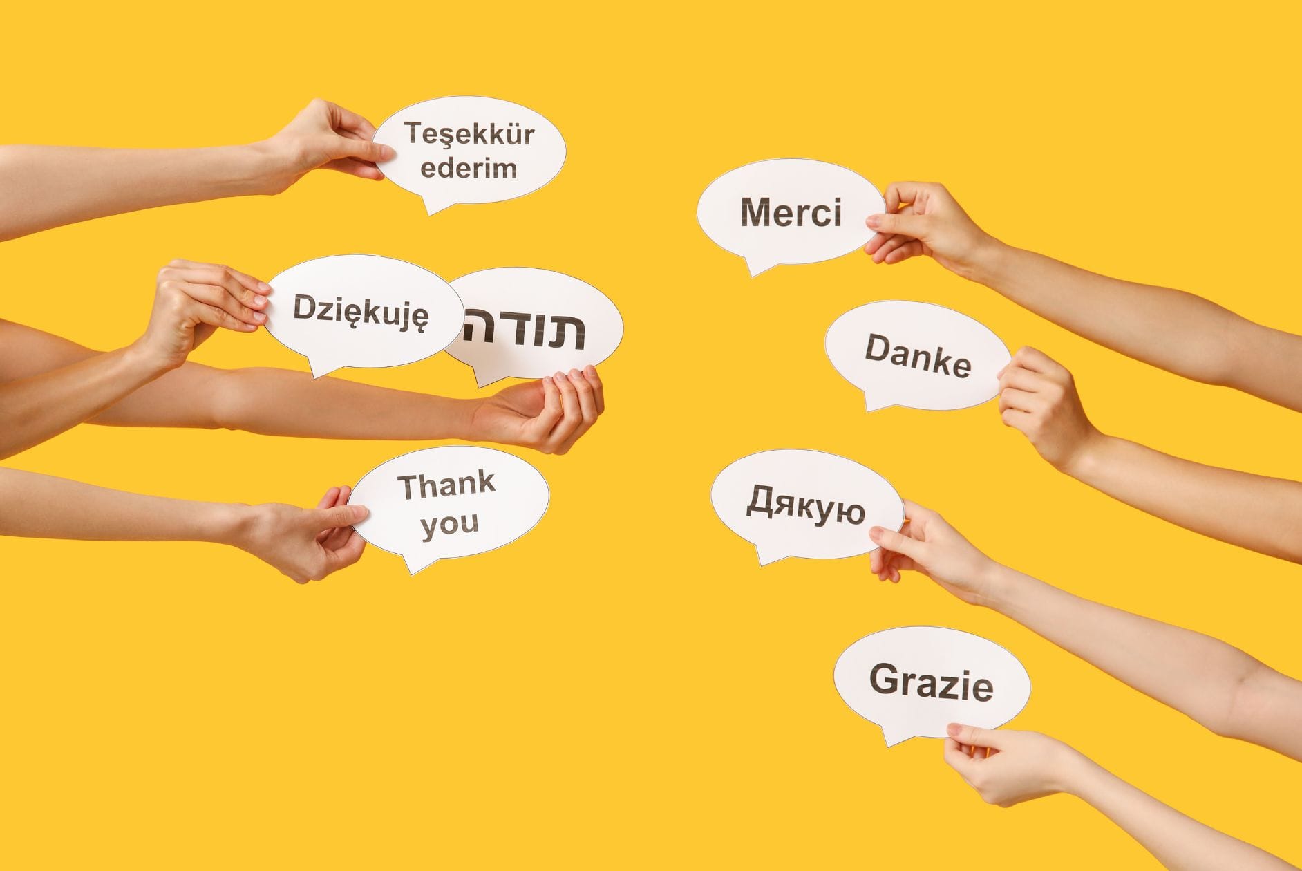 Hände die Sprechblasen mit Danke in verschiedenen Sprachen halten